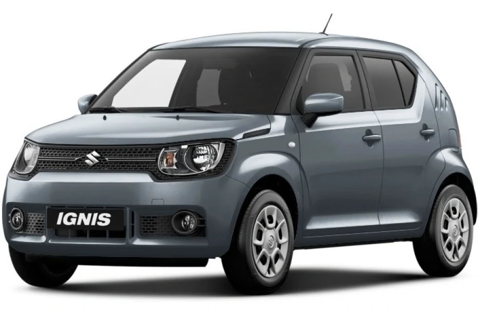 A grey Suzuki Ignis compact hatchback car is parked, viewed from the front left side, with black trim and clear windows. Rent Suzuki Ignis for your next drive and enjoy its stylish design and comfort.